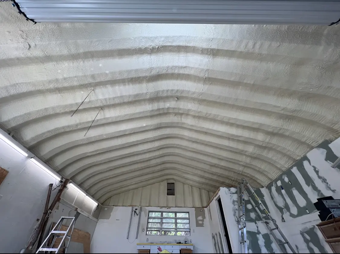 Spray polyurethane foam applied to the underside of a metal roof deck in Mead